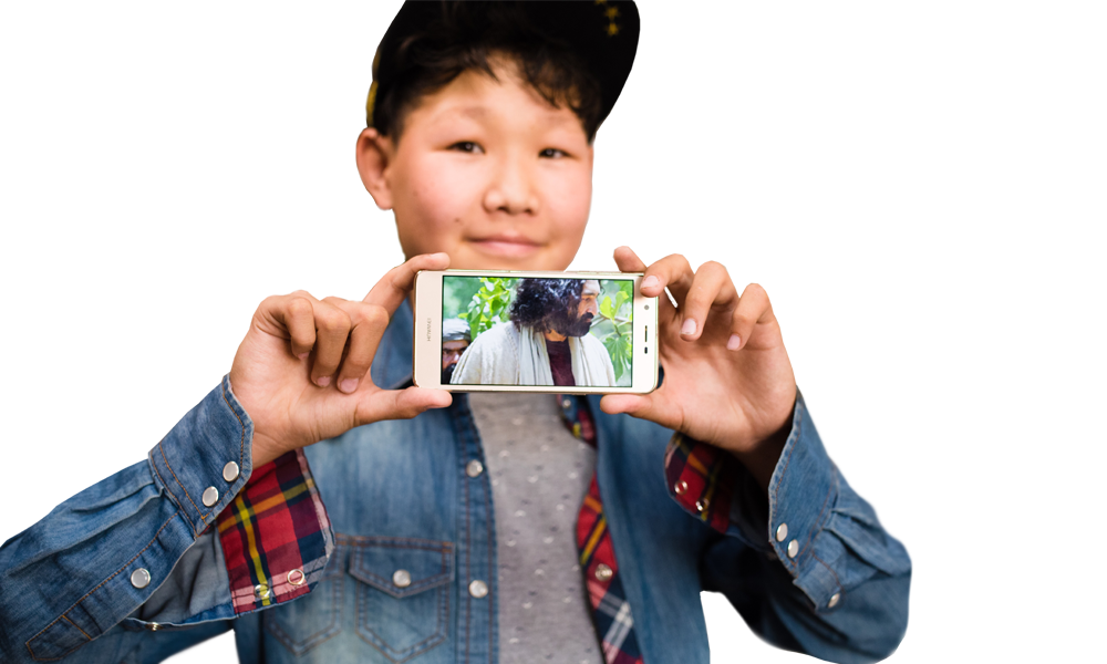 boy holding mobile device that's playing a video